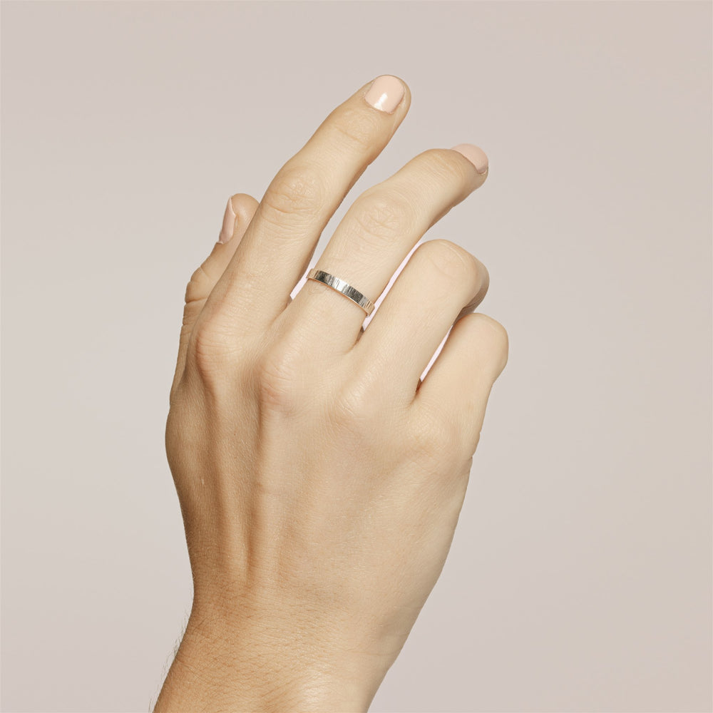 Aspen Ring in the narrow style on the model hand.