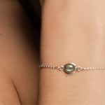 Moonstone Ria bracelet on model in closeup.