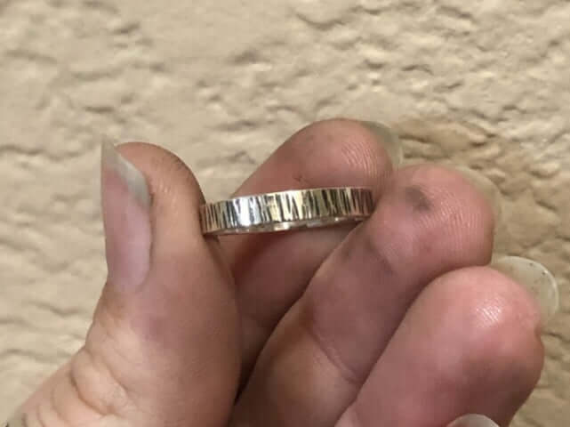 Closeup of Aspen Bark Ring held between thumb and fingers!