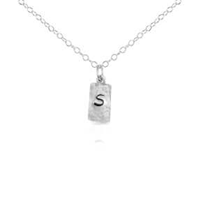 Silver rectangle initial necklace.