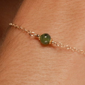 
                
                    Load image into Gallery viewer, Alora Bracelet with Jade on 14k Gold Fill Closeup on model.
                
            