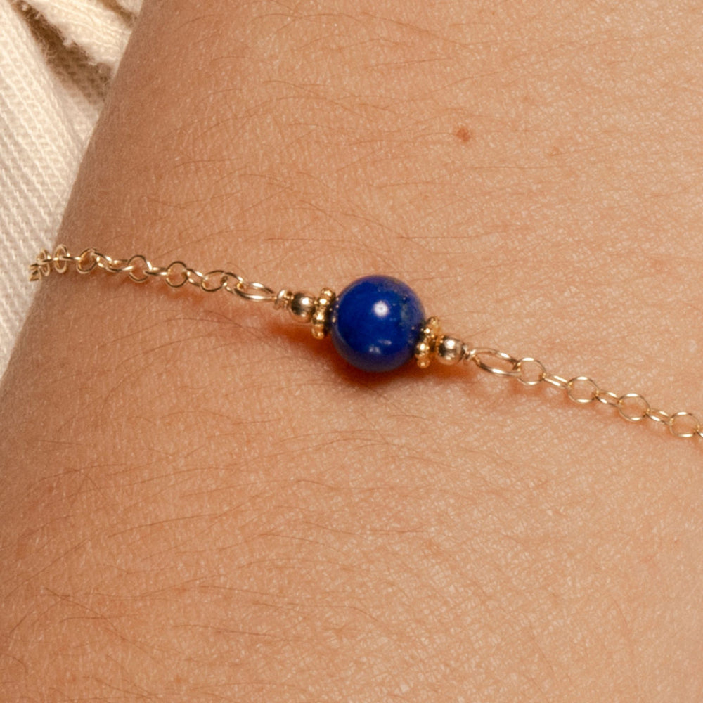 
                
                    Load image into Gallery viewer, Alora Bracelet with Lapis on Gold Fill Closeup on model.
                
            