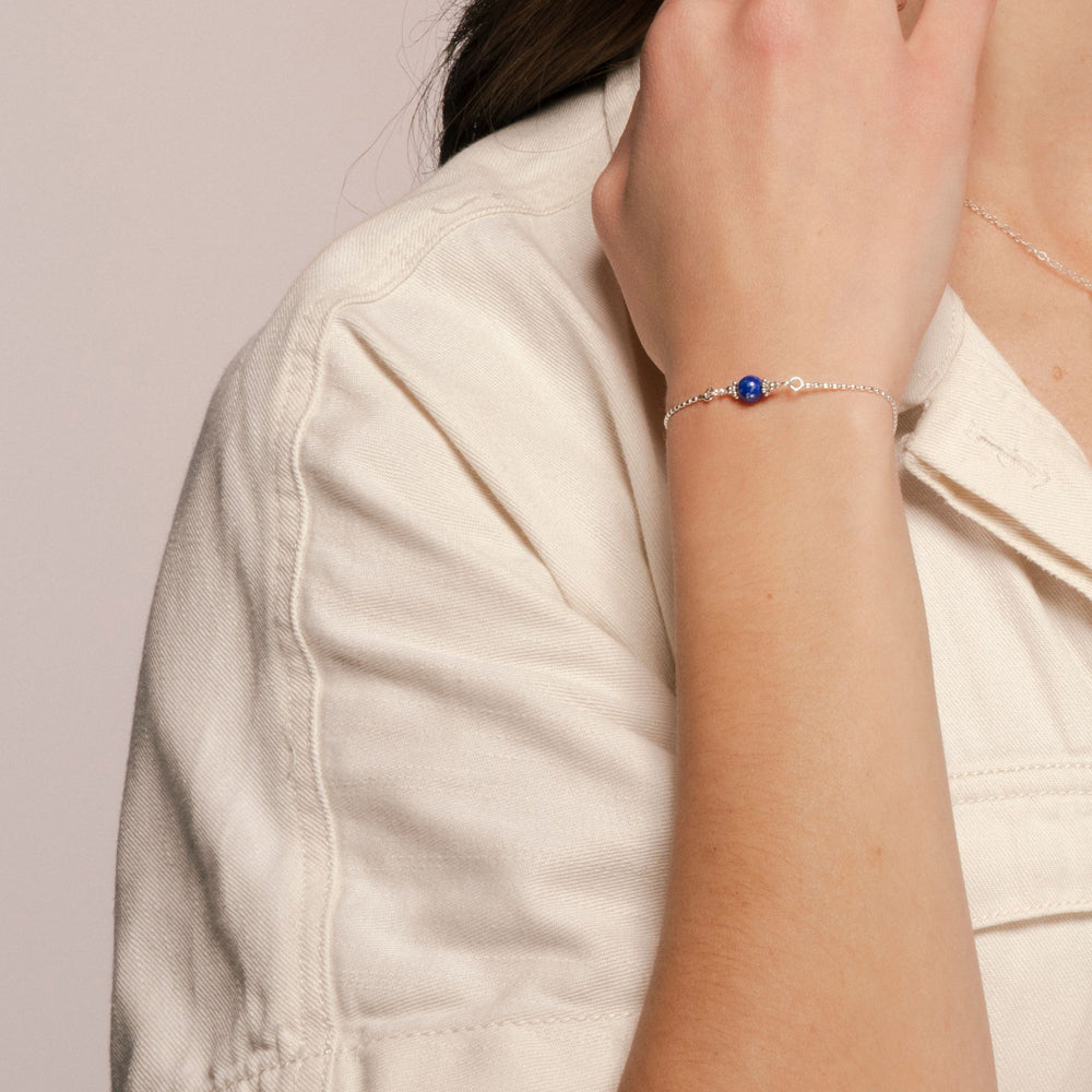 
                
                    Load image into Gallery viewer, Alora Bracelet with Lapis on Sterling medium shot on model.
                
            