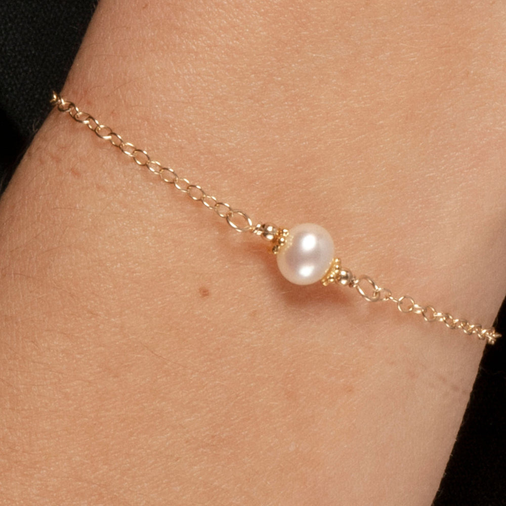 Alora Bracelet with Pearl on Gold Fill in closeup on model.