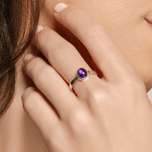 Ria ring with amethyst on model.