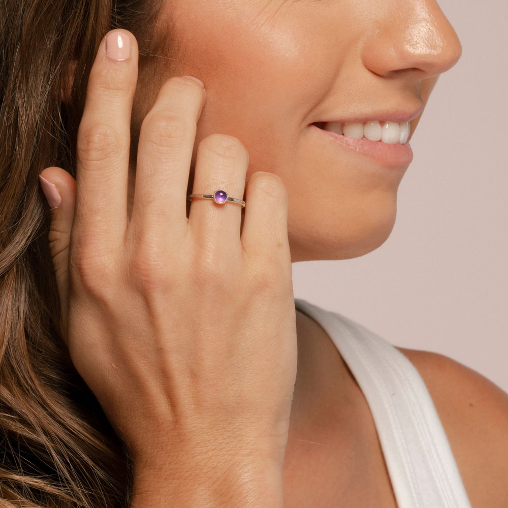 Facet Ring with amethyst on hand of model.
