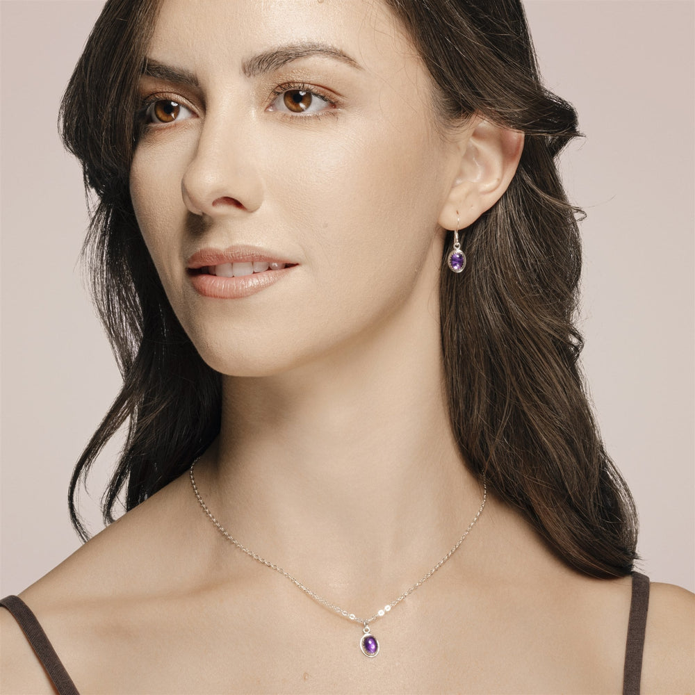 
                
                    Load image into Gallery viewer, Ria Amethyst earrings and necklace on model.
                
            