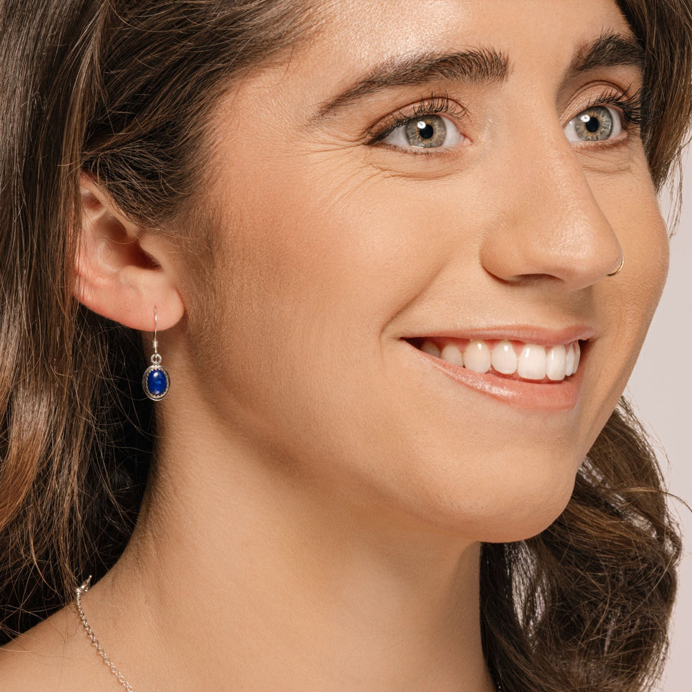 
                
                    Load image into Gallery viewer, Ria Earrings with Lapis Lazuli on model.
                
            