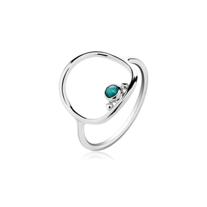 Cushion frame ring in the sunrise design standing with turquoise!