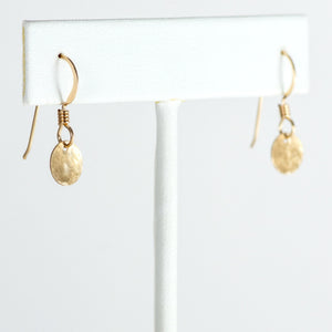 
                
                    Load image into Gallery viewer, Gold mini disc earrings on T stand.
                
            