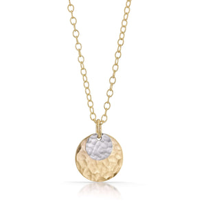 
                
                    Load image into Gallery viewer, Small textured silver disc on top of large gold disc necklace.
                
            