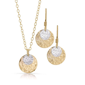 
                
                    Load image into Gallery viewer, Small silver disc on large gold disc jewelry set.
                
            