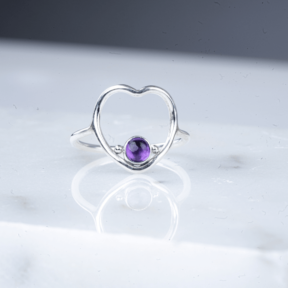 
                
                    Load image into Gallery viewer, Heart amethyst ring laying down.
                
            
