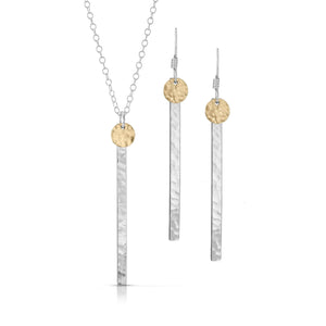 Small textured gold disc on skinny silver bar jewelry set.