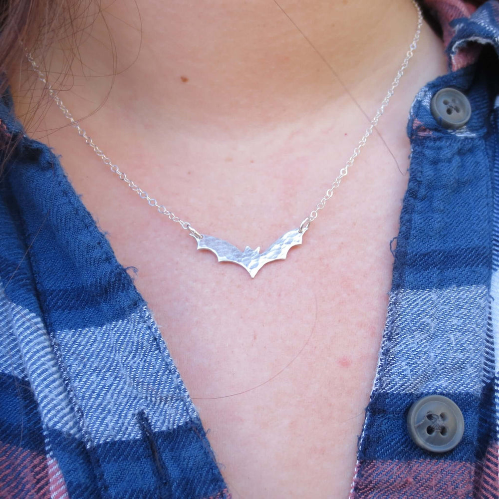 
                
                    Load image into Gallery viewer, Sterling silver bat necklace on model!
                
            