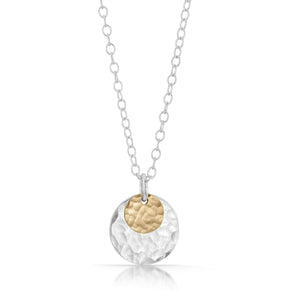 
                
                    Load image into Gallery viewer, Small textured gold disc on top of large silver disc necklace.
                
            