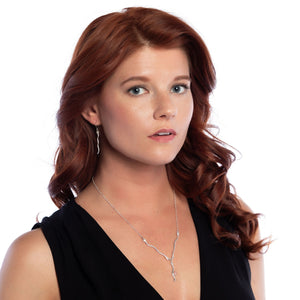 Wave rhodochrosite necklace and earrings on model.